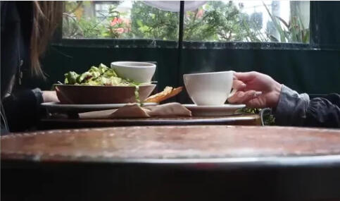 Table set with tea and food at a café, representing a Discover Healing event